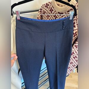 Navy blue trousers. Side zip with 4 button detail. Blue satin around inner waist